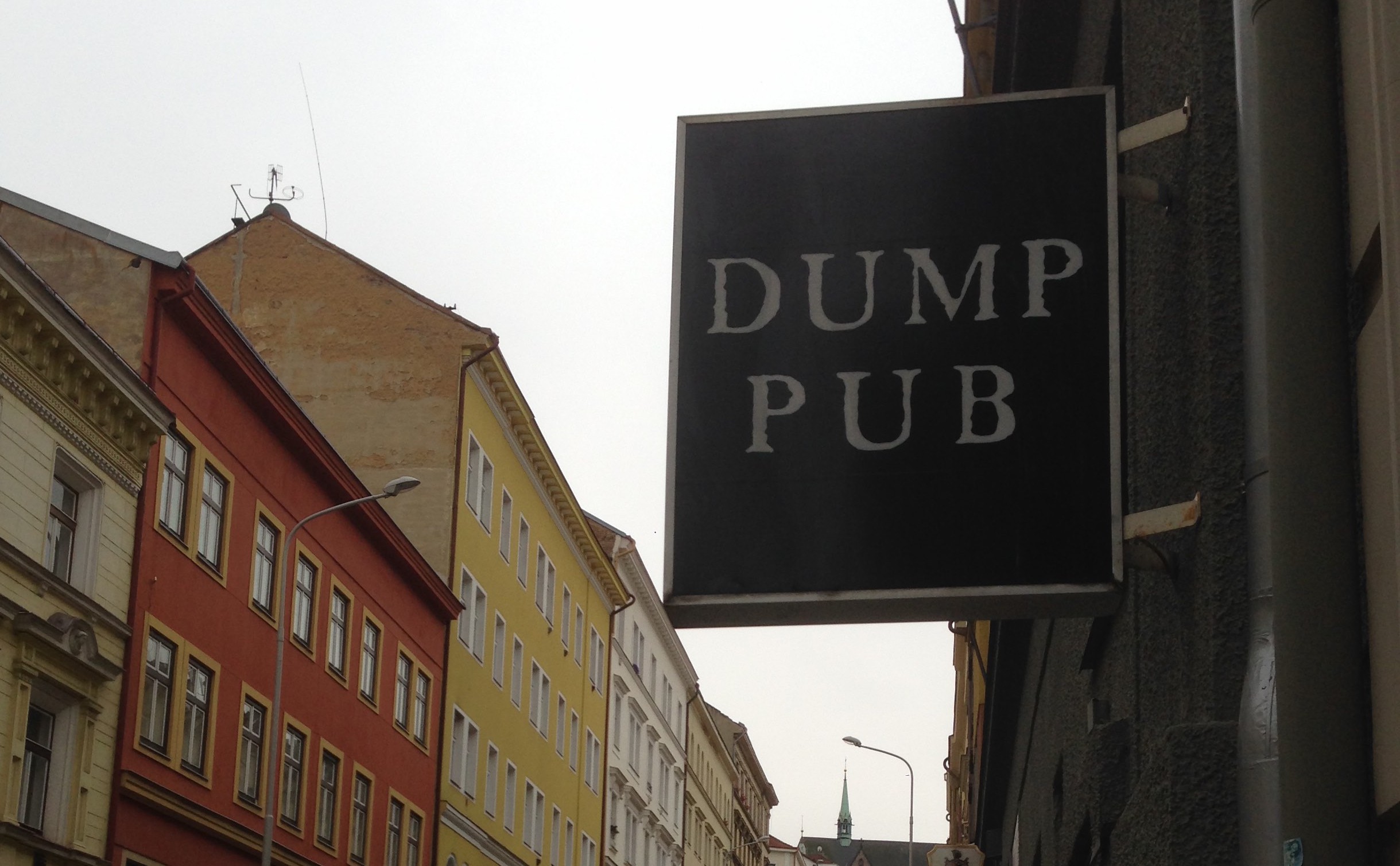 The sign outside Dump Pub in Prague