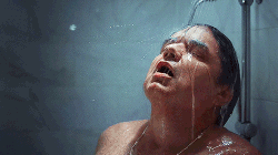 Oliver Platt in a shower, but the water turns to blood